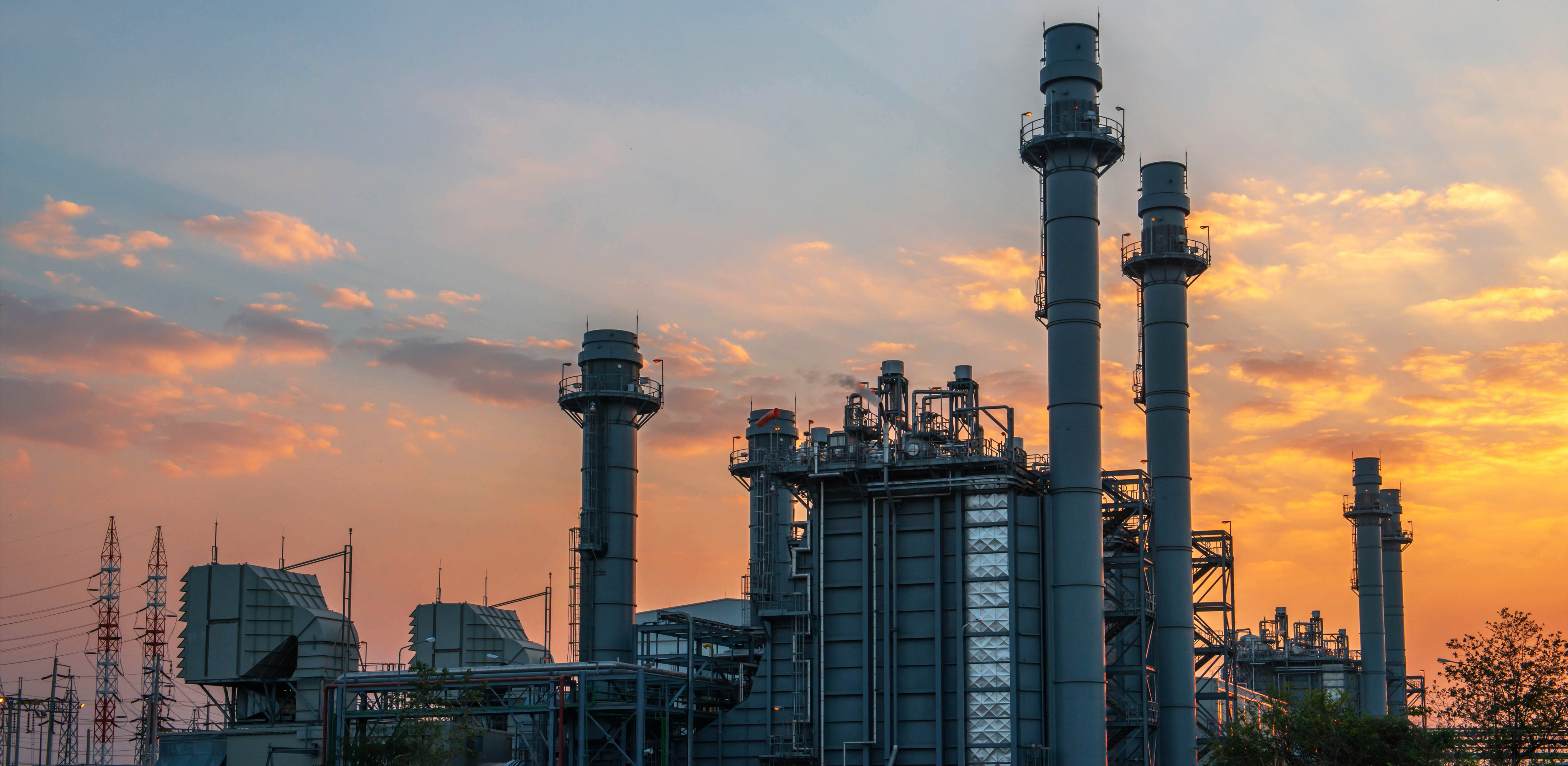 Combined-cycle power plant with cooling towers and turbines representing Lawrenceburg Power’s calibration operations.