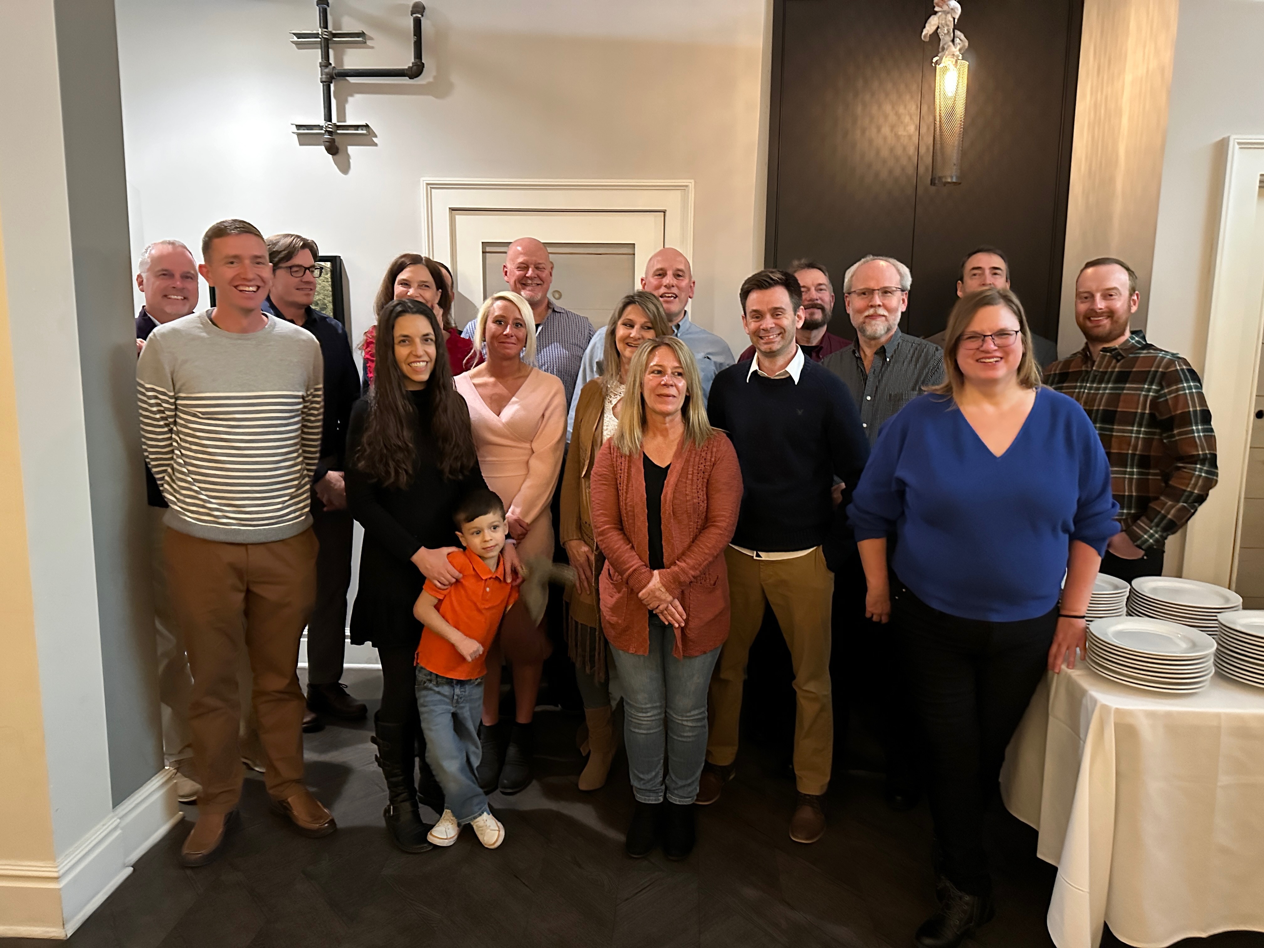 Ralston team members in a group photo during a company Christmas party at a local event venue.