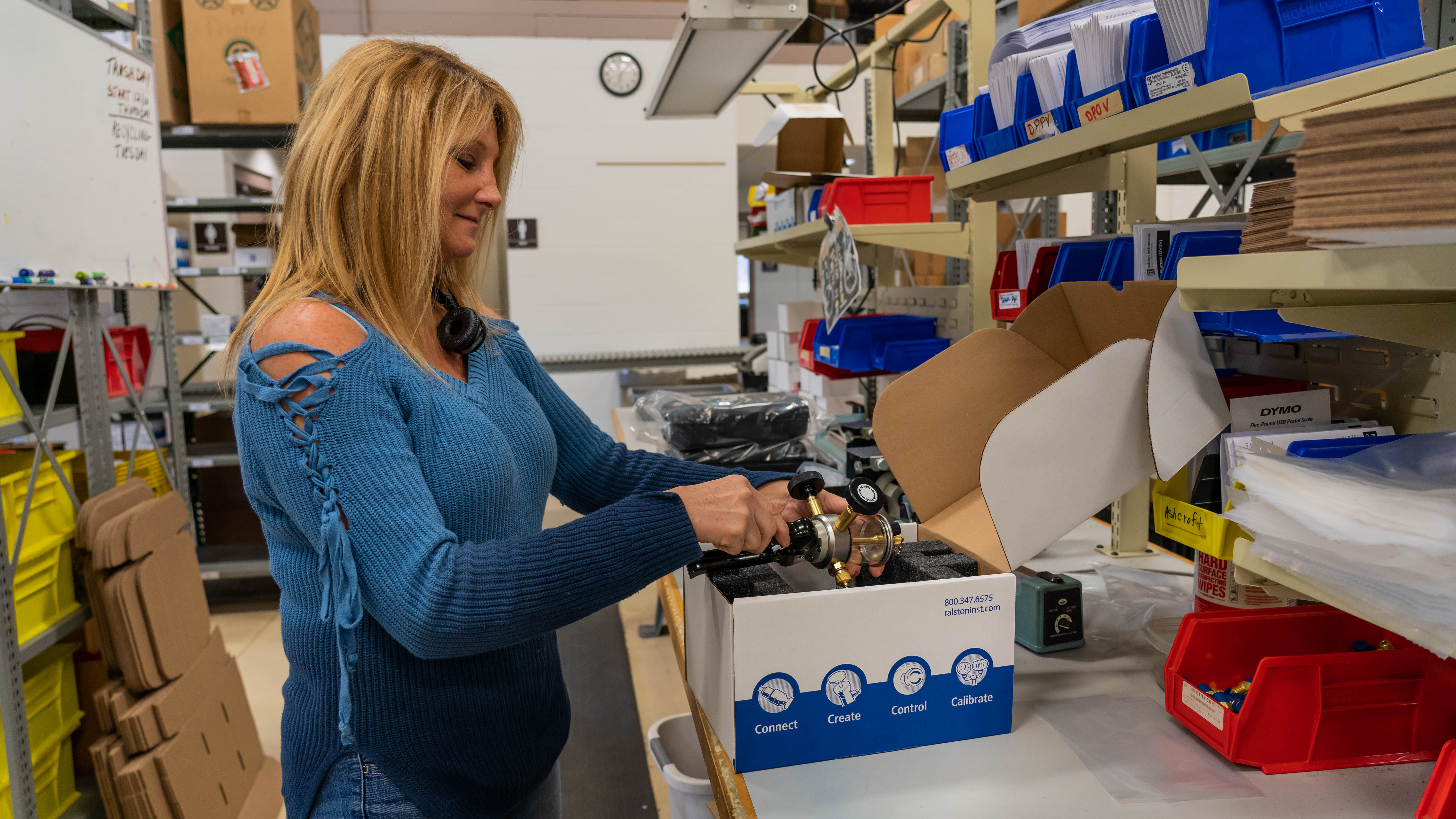 Ralston Instruments team member preparing products for shipment, reflecting quality and attention to detail