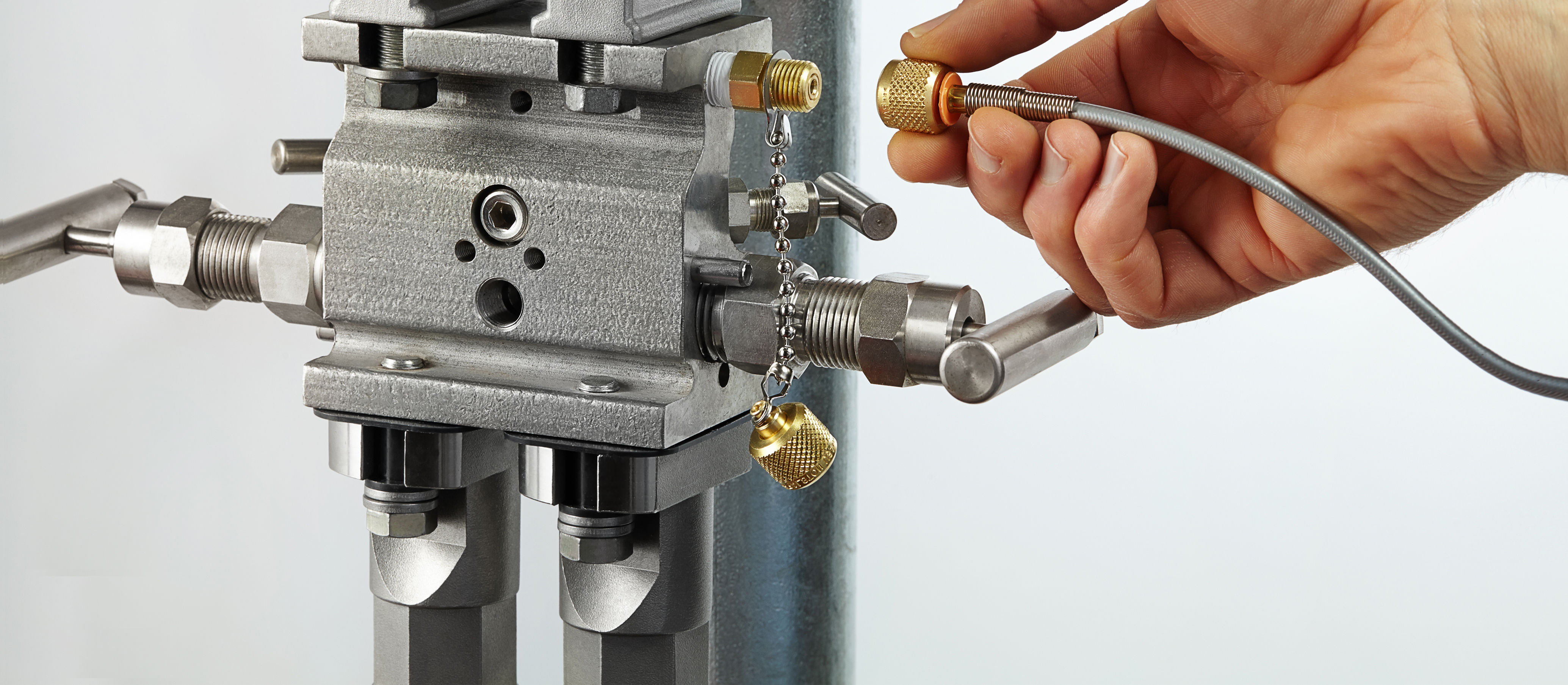 Ralston Quick-test hose connected to a pressure transmitter manifold and pump system