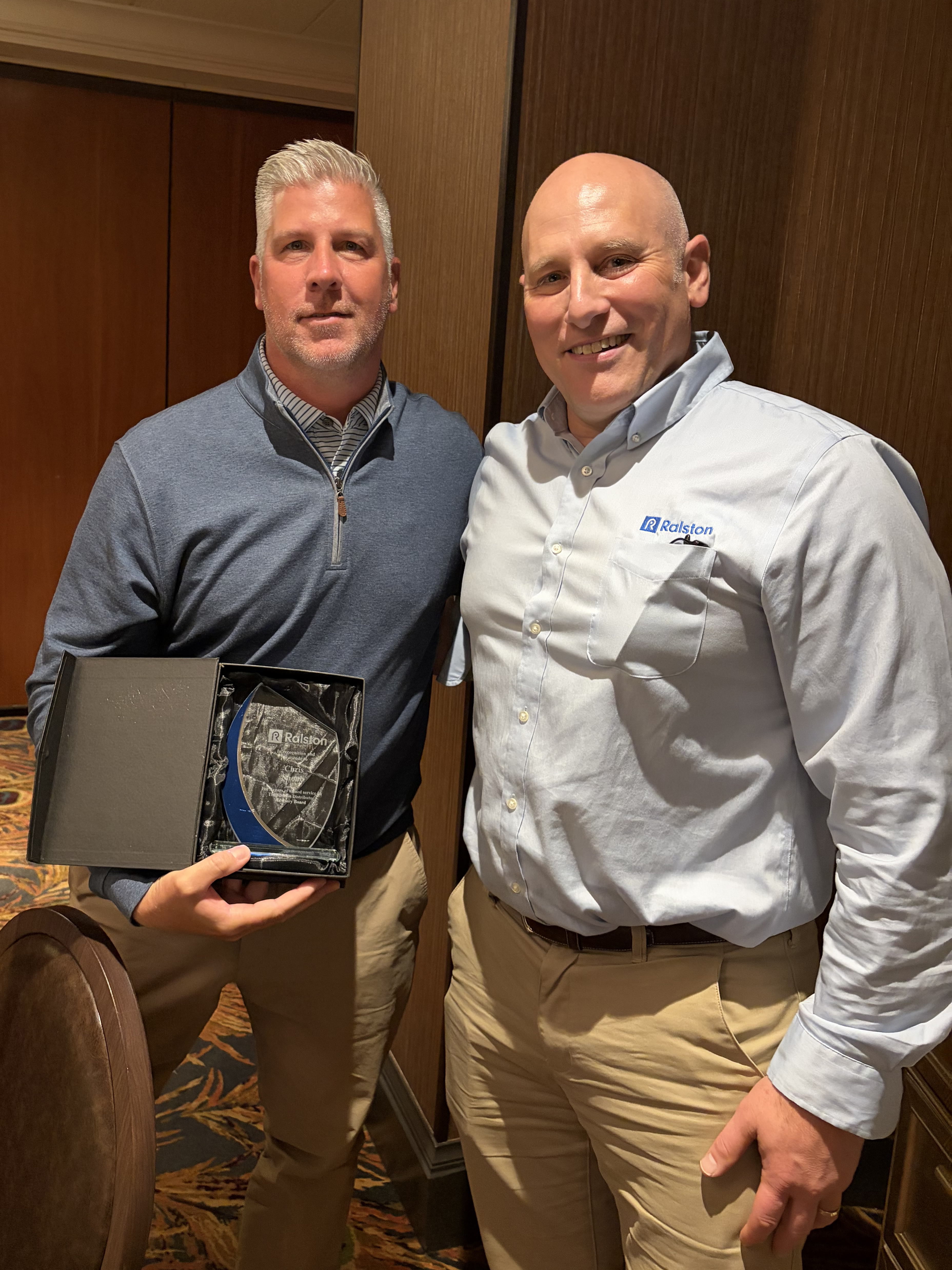 Chris Shoub of Myers & Co. (left) receives award for 3 years of service on Ralston's DAB from CEO Griffin Ralston (right).