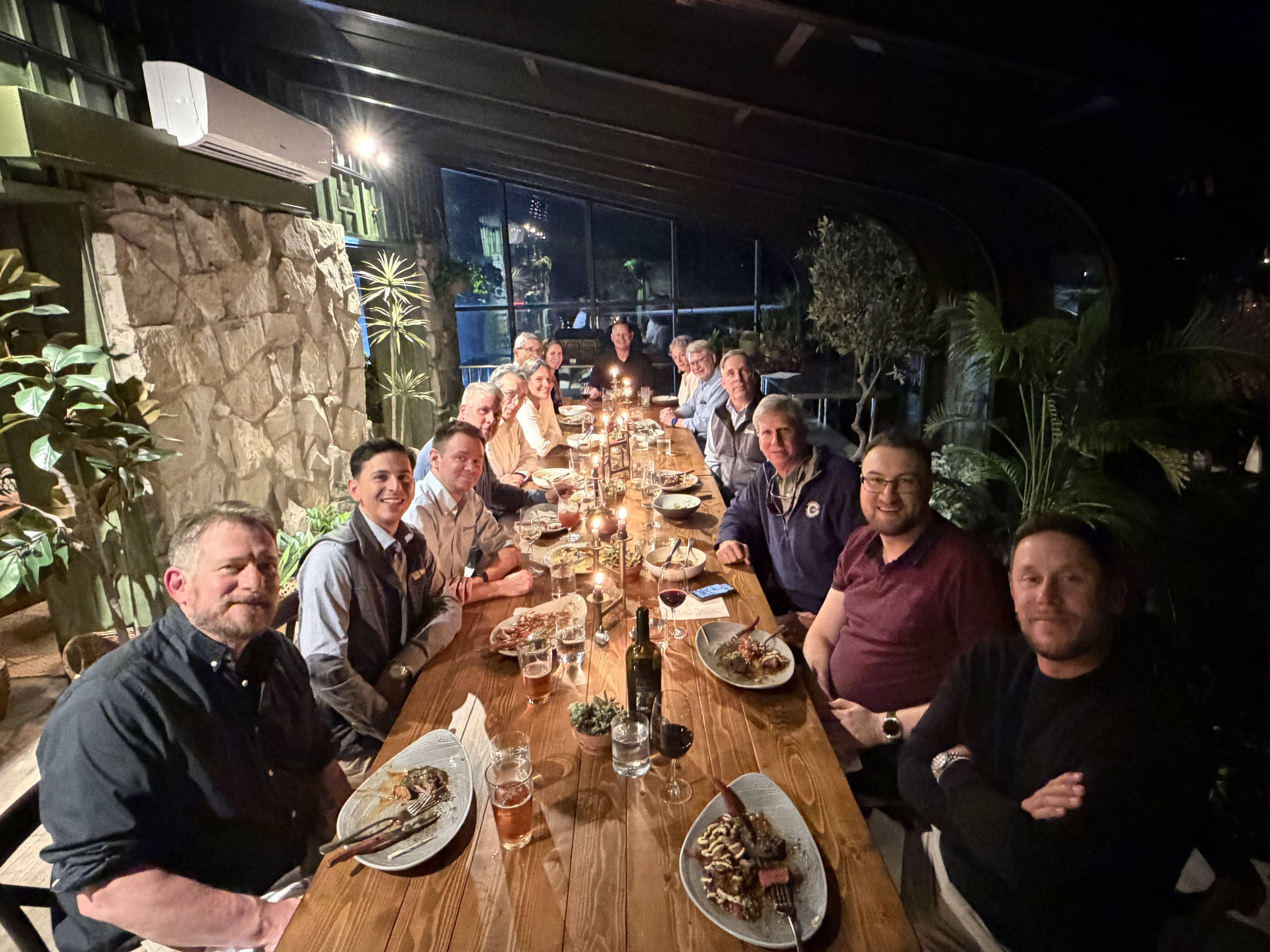 Ralston team members and distributors gather around a long dinner table in Cleveland, Ohio, during the 2026 DAB meeting.