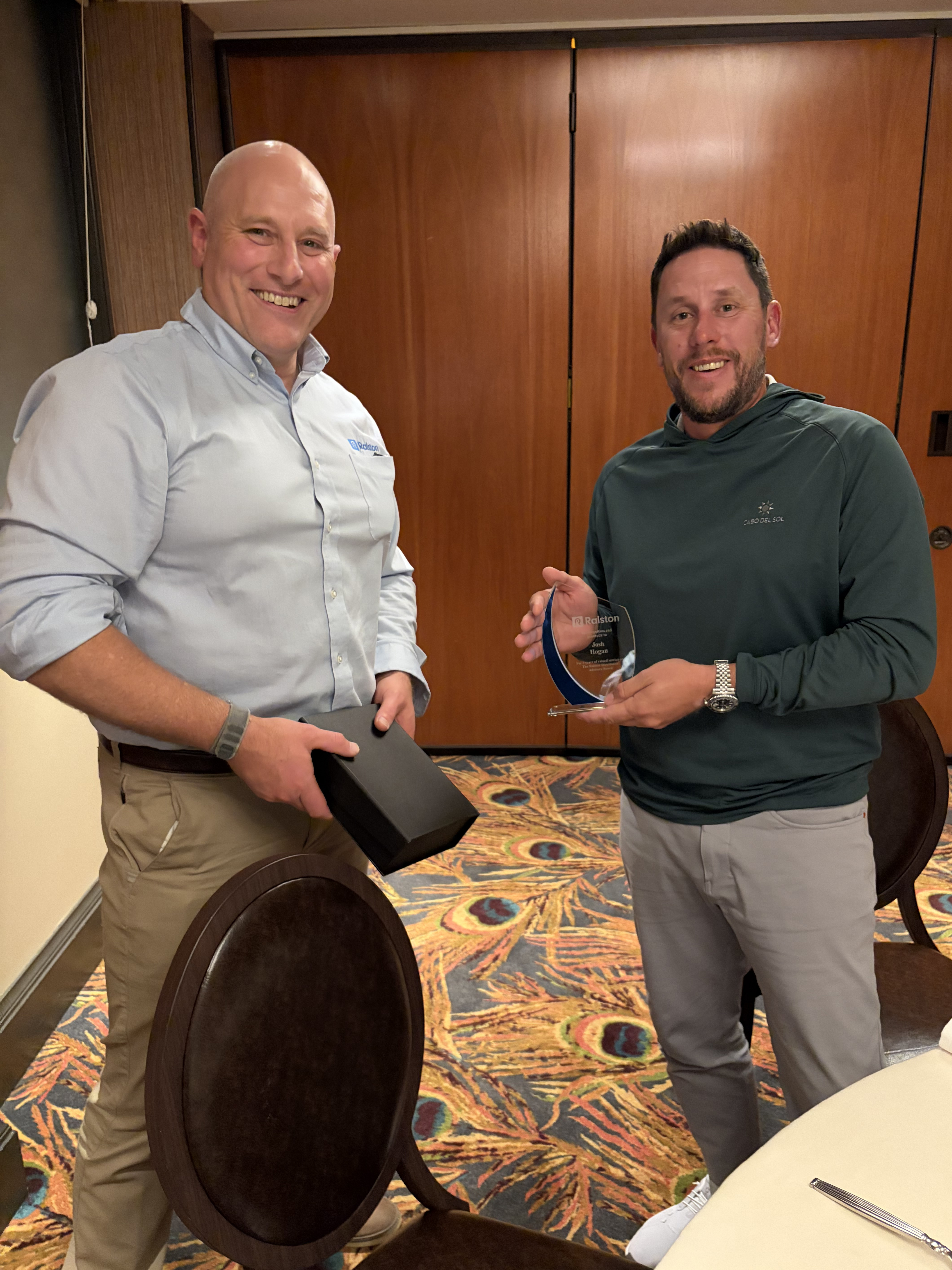 Griffin Ralston of Ralston Instruments (left), presents Josh Hogan (right) with an award for 3 years of service on the DAB.