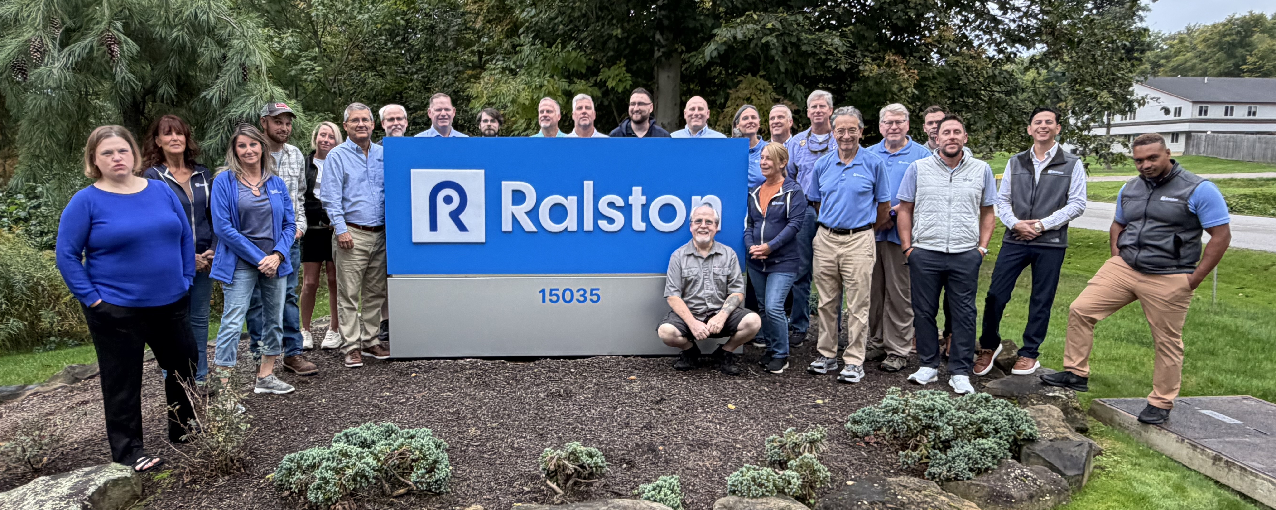 Ralston Instruments team members and distributors gather for a group photo outside Ralston headquarters in Newbury, Ohio.