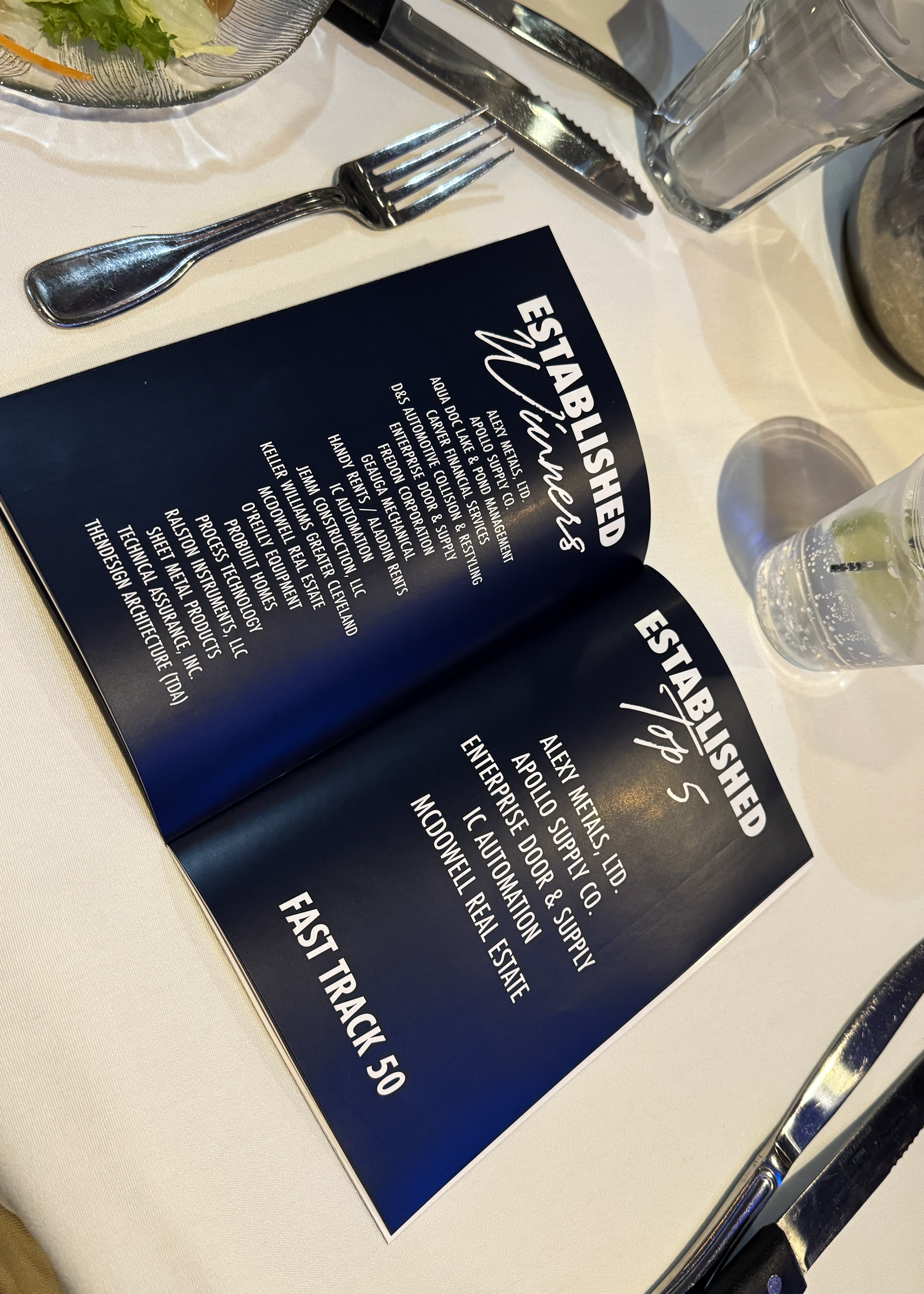 Close-up of the event program showing Ralston Instruments among 2025 Established Business winners.