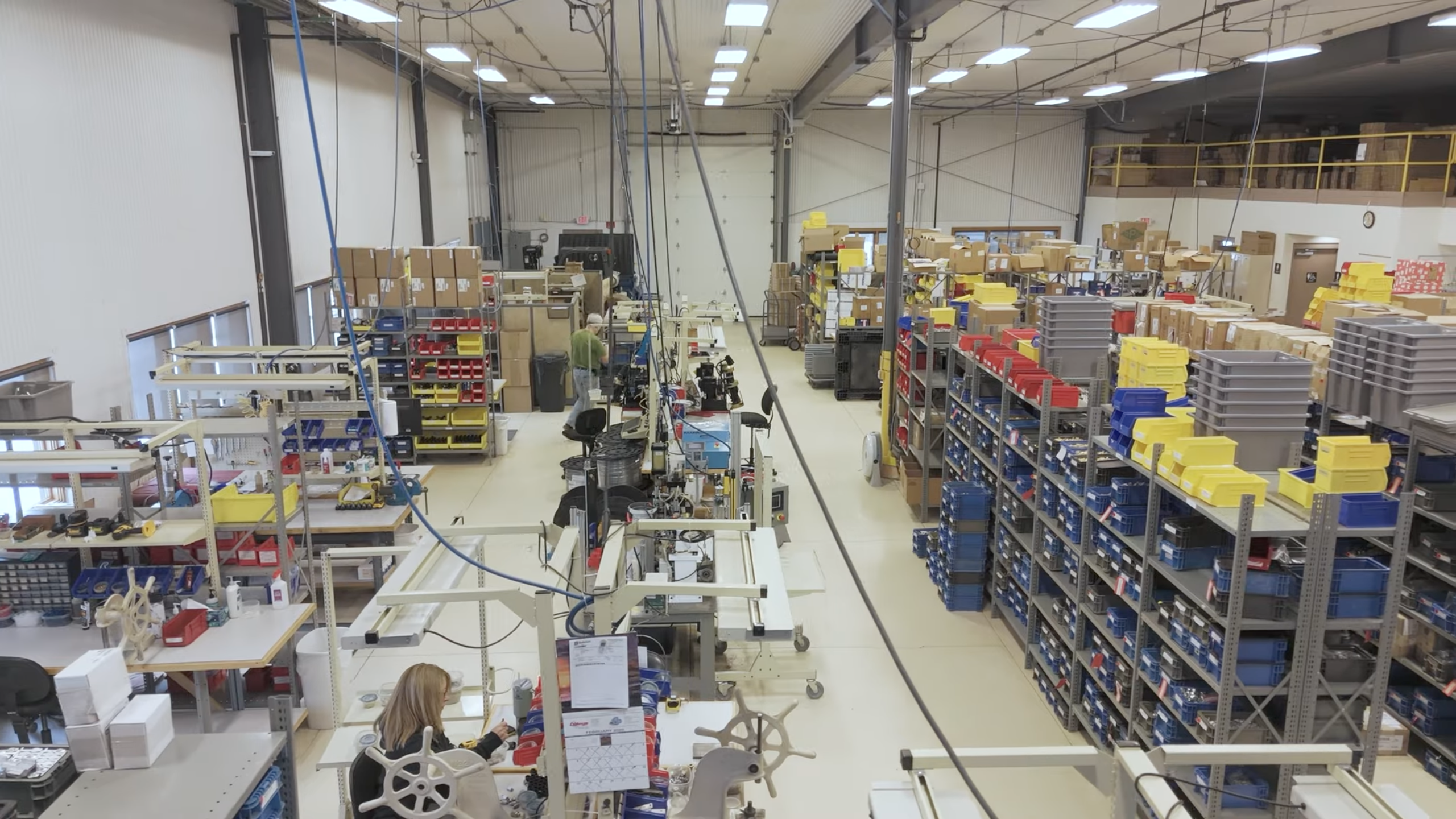 Wide view of the Ralston Instruments manufacturing floor in Newbury, Ohio, showing assembly stations and organized inventory